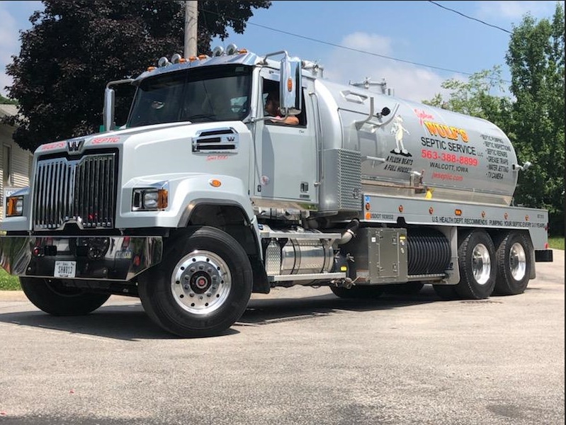 John Wulf's Septic Service truck on the road